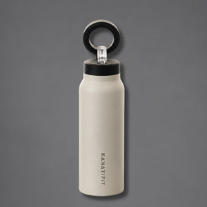 A matte off-white insulated water bottle with a black lid and a black carrying loop, featuring the vertical brand name 'KANATIFIT' printed on the front, set against a solid dark gray background.