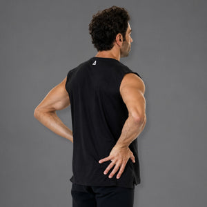 A man wearing a black sleeveless athletic tank top, shown from the back and side against a solid gray studio background.