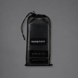 A black mesh drawstring pouch with a black label reading 'KANATIFIT' in white, photographed against a plain gray background.